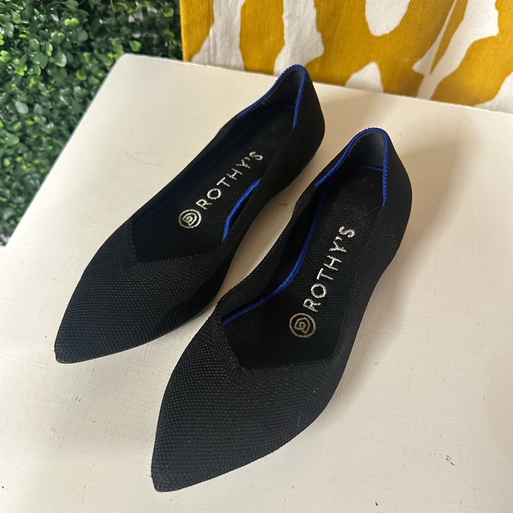 Rothy's Elegant Black Flats with Vibrant Blue Accent